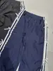 [Salida de fábrica] cintura elástica encaje franja lateral blanca puntera de mariposa pantalones pantalones casuales pantalones deportivos