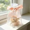 Temu bolsa de rede branca com bloqueio de cores e laço para presente de perfume, batom, embalagem de doce