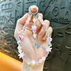 Cadena para teléfono móvil con lazo de aleación con cuentas, llavero, colgante, funda de teléfono móvil, correa de muñeca, accesorios para bolso, regalo pequeño, venta al por mayor