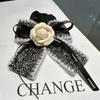 2023 nuevo estilo Chanel Camelia banda para el cabello Lazo anillo intestino grueso todo-combinable cuerda para el cabello de tela para mujer accesorios para el cabello