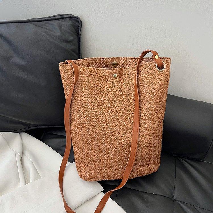 编织包女包新款潮2024夏草编简约百搭小清新水桶包个性单肩斜