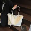 Bolsa tote de gran capacidad, nuevo modelo 2026, con un tacto sofisticado y lujoso, hecha de cuero suave, una bolsa de hombro grande adecuada para el trabajo y los desplazamientos, y puede albergar un portátil