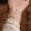 Pulsera de Plata 990 Hueca de Trébol de Cuatro Hojas para Mujer Estilo Antiguo Cepillado Diamante de Punto Cruz Flor de Alto Nivel Lujo Accesible