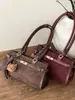 Bolsa de Ombro Retro de Alta Qualidade para Commuter Feminino 2025 Nova Bolsa Simples de Camurça Bolsa Platina