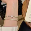 Pulseira de Trevo de Quatro Folhas Elástica com Flor de Diamante Pequena Entrada de Luxo Nicho Feminino Exquisita Flor Fada Salpico Muito Fina Pulseira Versátil