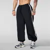 Pantalones deportivos largos para hombre transfronterizos con franjas laterales, cordón y puños elásticos, adecuados para correr, fitness, tenis, entrenamiento de baloncesto y uso casual