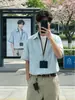 Suéter de dos piezas falsas estilo americano con cuello de solapa, camisa de manga corta a rayas para hombre, camisa casual versátil unisex estilo japonés