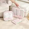 Set de organizadores de viaje de dibujos animados, incluye tres piezas: un organizador de equipaje, un organizador de ropa y un organizador de lencería, con una bolsa de malla portátil