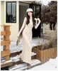 Vestido Longo de Lã com Decote V Dongdaemun Coreano Slim Fit Cintura Marcada Malha Cauda de Peixe Cor Sólida Roupa de Baixo Outono/Inverno