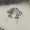 Pendientes de Mariposa Huecos con Circonita Morada Fresca para Mujer, Lujo Ligero, Exquisitos, Estilo Fresco, Pendientes de Moda y Versátiles al por Mayor