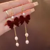 Pendientes de Borlas con Lazo Rojo 2026 Nuevo Estilo Caliente Lujo Ligero Gama Alta Pendientes de Año Nuevo Accesorios de Oreja Únicos de Nicho