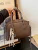 Bolso de mano casual y moderno, bolso para el trabajo, bolso tipo almohada, nuevo y moderno bolso de hombro de color liso, estilo retro versátil, el bolso popular para mujer de este año