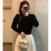 Top elegante de cuello redondo estilo coreano para primavera y otoño con mangas abullonadas y entallado en la cintura, suéter de punto liso hueco de invierno para mujer