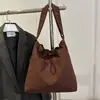 Bolsa de Ombro Cruzada Versátil Simples Casual Elegante Texturizada de Grande Capacidade Nova Moda Outono 2026 Nicho de Alto Valor Estético