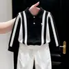 Estilo Coreano Meninos 2026 Outono/Inverno Novo Conjunto de Suéter de Malha com Gola Polo em Blocos de Cor Preto e Branco Calças Brancas de Perna Reta para Crianças