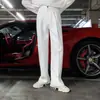 Pantalones largos casuales de pierna ancha con caída, moda simple de alta gama estilo Hong Kong para hombre, otoño 2026, nuevo estilo de otoño