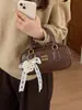 Bolsa de Mão Quadrada Pequena Boston para Mulheres, Nova Tendência Coreana de Moda de Alto Padrão com Textura, Vendida em Larga Escala Transfronteiriça, Bolsa Transversal