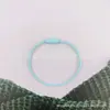 Cuerda de alambre de acero galvanizado con pintura de color directo de fábrica llavero de color caramelo etiqueta bolsa cordón de llave de dibujos animados