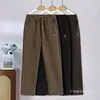 Outono de 2026 Novo Calça Mom Casual Reta Bordada de Cintura Alta Quente Moda Roupa de Fora Calça de Cintura Elástica