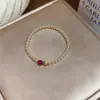 Pulseira redonda de pérolas com contas estilo francês, luxo leve, de alta qualidade, moderna e requintada, adequada para o uso diário, acessório feminino versátil.
