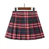 Falda plisada para niña, versión coreana, nuevo modelo 2024, versátil falda corta estilo escolar para niños, uniforme de escuela primaria