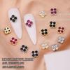 Nuevo arte de uñas transfronterizo color circón trébol de cuatro hojas joyería de circón de lujo japonesa flor accesorios para uñas diamante al por mayor