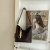 Bolso de mujer versátil de gran capacidad moda transfronteriza otoño 2026 nuevo simple para ir al trabajo hombro cruzado cubo