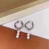 Pendientes coreanos Dongdaemun para mujer, sencillos, combinables, retro, elegantes, con perlas de agua dulce, pendientes de botón con diseño de viento frío.