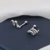 Nuevo mini pequeño serpiente de espíritu clavo de oreja hebilla de tornillo clavo de hueso de oreja accesorios para orejas diseño de nicho pendientes diamante verde lujo ligero venta al por mayor