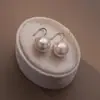 Gancho de Orelha com Argola de Pérola Redonda Amarela Agulha de Prata S925 Design de Nicho Feminino Senso Avançado Simples Versátil Brincos Explosões