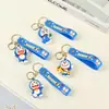 Chaveiro de borracha macia em PVC com logotipo personalizado, pingente de celular, pingente de chave de personagem de desenho animado 3D para homens e mulheres