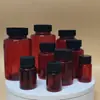 Botella Cápsula Negra a Prueba de Luz Marrón Botella Redonda para Mascotas Botella Muestreadora de Polvo 100ml Boca Ancha Botella Dosificadora de Plástico Venta al por Mayor