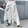 Conjunto de Verano de Moda para Niñas 2026 Nuevo Estilo Niños Mayores Jeans Rasgados Elegantes Top de Manga Corta con Letras Conjunto de Dos Piezas