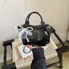 Bolso de mano de color liso de diseño de nicho para mujer, nuevo modelo de verano 2026, bolso de hombro casual texturizado, bolso cruzado único