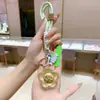 Colgante Llavero Dorado, Regalo Cultural y Creativo del Año del Caballo, Colgante Llavero Bolsa Flor de Dinero de Oro Puro, Llavero Decorativo