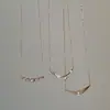 Set de brocas con sentido del diseño, colgante de tubo curvo de circón, collar de oro rosa para mujer, gargantilla de lujo ligero de nicho, cadena para clavícula