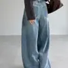 Jeans de diseño Dongdaemun coreano con hebilla en la cintura trasera, color azul lavado, dobladillo curvo para mujer, pantalones anchos de otoño, pantalones tipo dad