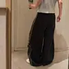 Calça de moletom casual larga e estilosa estilo americano com grafite de espinhos e estampas grandes em ambos os lados, calça de dança casual hip-hop