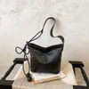 Bolsa feminina simples retrô transfronteiriça 2026 nova bolsa de ombro transversal casual versátil para trabalho e deslocamento bolsa saco