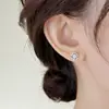 Pendientes de botón de plata de ley S925 con aguja, flor fresca, copo de nieve, incrustaciones de diamantes de imitación, nuevo diseño exquisito de nicho de lujo ligero 2026, personalizados