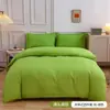 Funda de almohada con bolsillo, funda nórdica de tela cepillada de color liso, juego de tres piezas transfronterizo, funda nórdica de plumón, ropa de cama textil para el hogar de fibra ultrafina