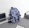Mochila de marca de moda para hombre, moderna y genial, de gran capacidad, con grafiti, para estudiantes, escolares, universitarios y de viaje.