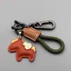 Nuevo Producto Riqueza Inminente Colgante Creativo de Cuero Caballo Pequeño Riqueza Inminente Cuerda Tejida Llavero de Coche Bolso Venta al por Mayor Regalo