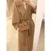Elegante abrigo de lana con cuello de solapa de color liso para mujer, abrigo largo de lana holgado de invierno de alta gama y elegante.