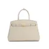 Bolso de mano elegante y nuevo para mujer, con un diseño único, un tacto de alta gama y gran capacidad, fabricado en piel de vacuno, y se puede llevar al hombro o cruzado.