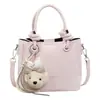Yuezizhi 2026 principios de otoño nuevo estilo inspired en Chanel bolso cruzado versátil lindo con colgante tipo cubo con sensación de alta gama, bolso de mano y bolso de hombro