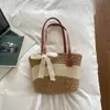 Bolso tipo cubo de moda color block nuevo para el día a día 2026, bolso de playa de paja a rayas, bolso de hombro casual para viajar, bolso tote