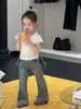 Ropa Infantil Nueva de Verano 2026, Camiseta de Manga Corta con Encaje y Cuello en V Floral Francesa para Niñas, Elegante Camiseta Ajustada