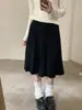 Saia midi plissada de tricô estilo retrô coreano 2026, que rejuvenesce, preppy, versátil e afina a silhueta, perfeita para looks de outono e inverno, saia de meio corpo feminina