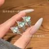 Venta al por mayor del fabricante Anillo de jacinto de agua azul natural de jade con incrustación de plata S925, Nuevo diseño de estilo chino